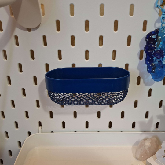 I own a board that allows for a lot of customization by giving each shelf hooks that can be placed anywhere on the board. I use this shelf to display trinkets and other items I've collected, so I think adding a circuit with lights could help improve my display and give the things I collected the focus of my board.