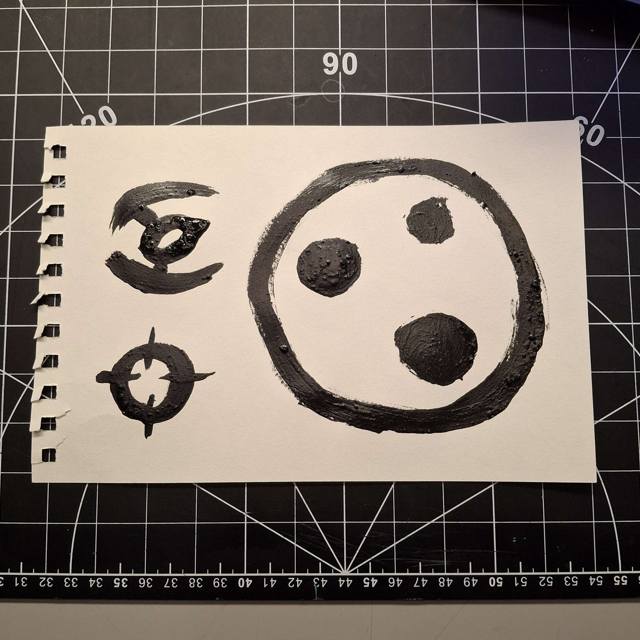 For this design, I tried to go for a random sigil design combined with a gamepad. The idea would be that somehow the big sigil would act as movement controls.