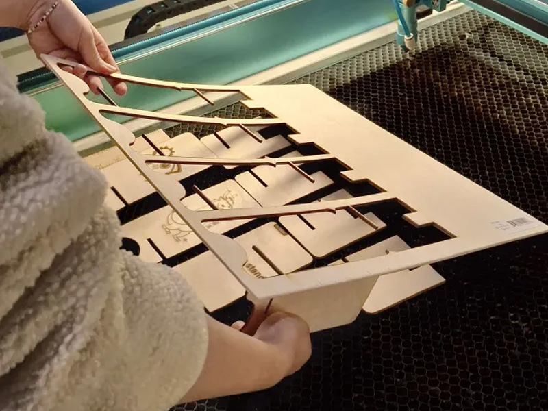 Once it was done, the phone holders could be popped out and assembled. We were told we could sand it if the pieces didn't fit properly and to prevent stray wood from sticking out if we needed to.