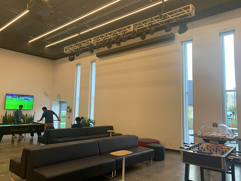 This is one half of the marquee. This is more of a lounge area since there's couches for resting and various tabletop games. When discussing this space with my group, we all agreed that the overall placement of the furniture is odd and seems like it’s struggling to pick an identity. The tables are too small to use practically, and the games are placed too close to some of the couches.